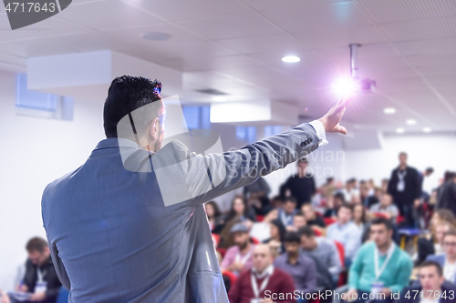 Image of businessman giving presentations at conference room