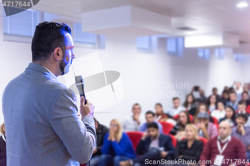 Image of businessman giving presentations at conference room