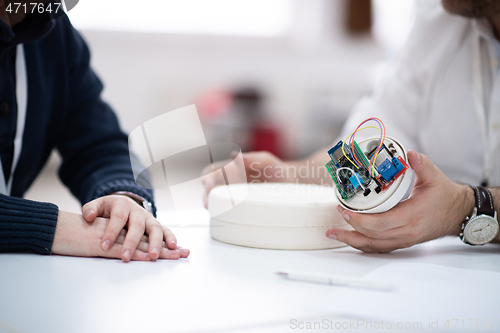 Image of engineers working and discussing about project