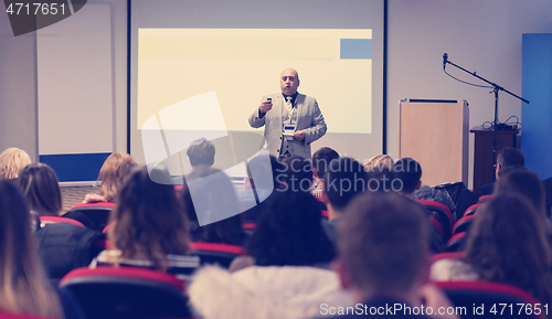 Image of businessman giving presentations at conference room