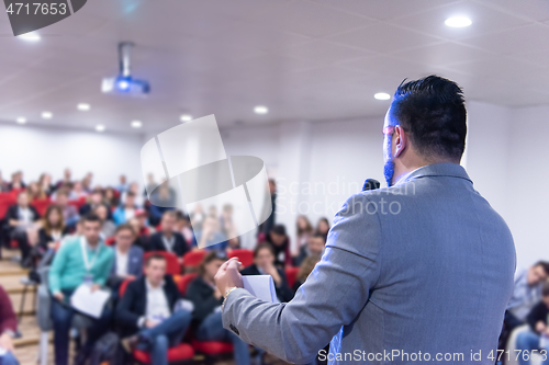 Image of businessman giving presentations at conference room