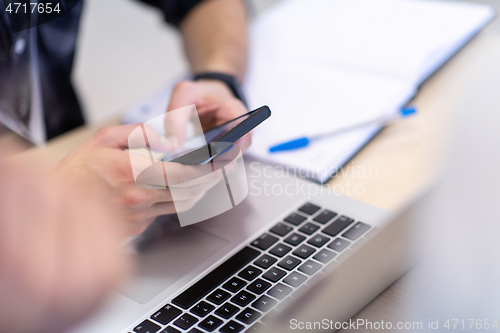 Image of business people hands using smart phone