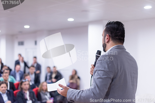Image of businessman giving presentations at conference room