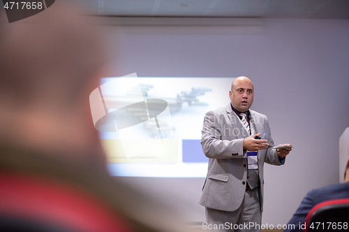 Image of businessman giving presentations at conference room