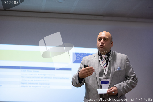 Image of businessman giving presentations at conference room