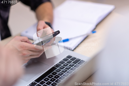 Image of business people hands using smart phone