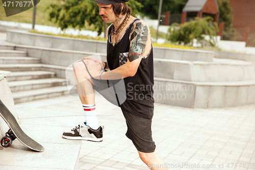 Image of Skateboarder at the city\'s street in cloudly day