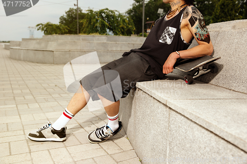 Image of Skateboarder at the city\'s street in cloudly day