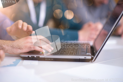 Image of business people hands using laptop computer