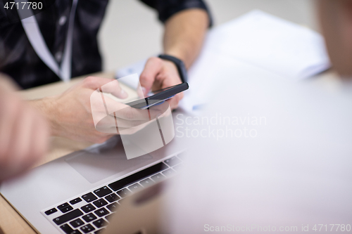 Image of business people hands using smart phone