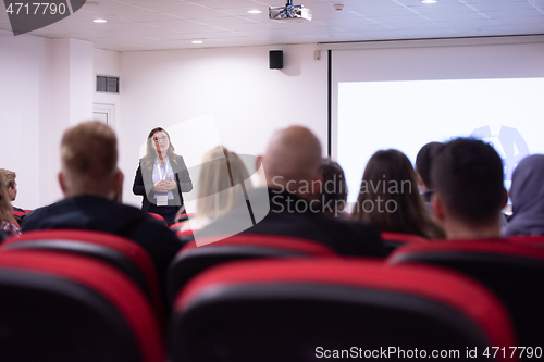 Image of businesswoman giving presentations at conference room