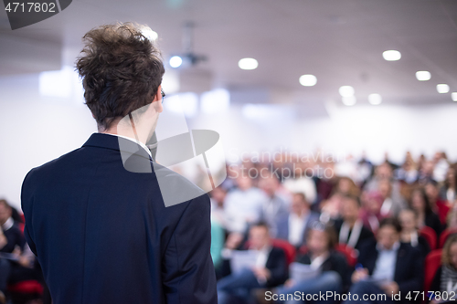 Image of businessman giving presentations at conference room