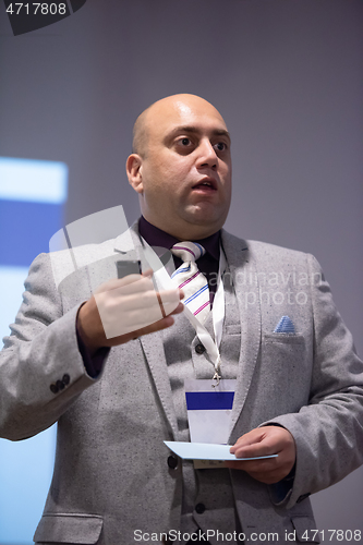 Image of businessman giving presentations at conference room