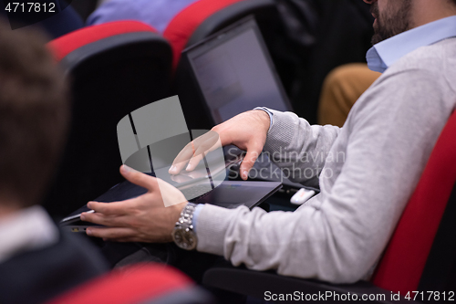 Image of business people hands using laptop computer
