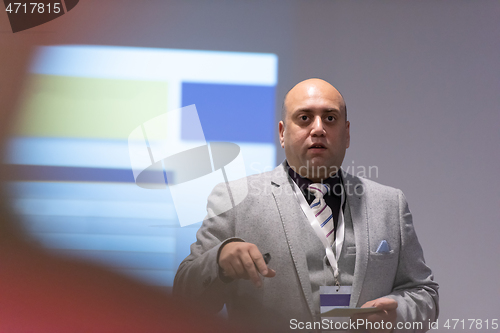 Image of businessman giving presentations at conference room