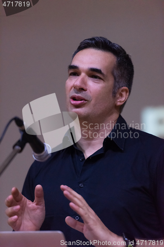 Image of businessman giving presentations at conference room