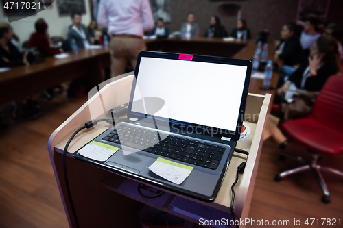 Image of laptop computer at podium