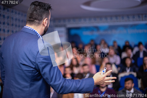 Image of businessman giving presentations at conference room