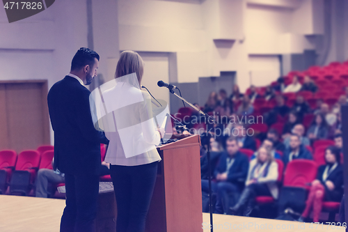 Image of businesspeople giving a presentation