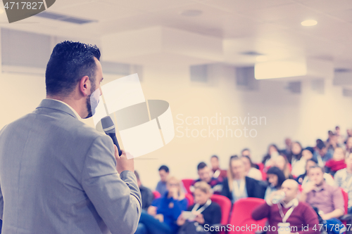 Image of businessman giving presentations at conference room