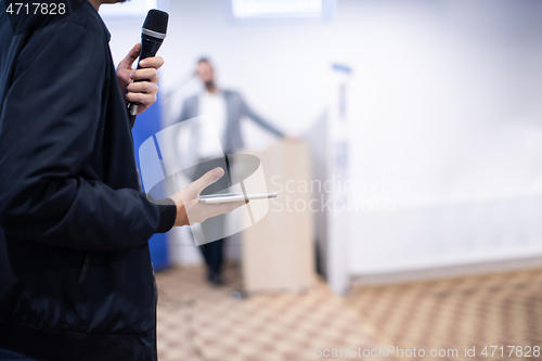 Image of businessman giving presentations at conference room