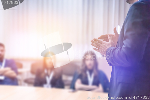 Image of businessman giving presentations at conference room