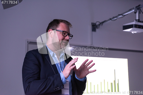 Image of businessman giving presentations at conference room