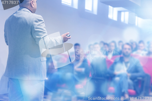 Image of businessman giving presentations at conference room