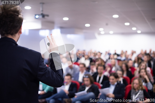 Image of businessman giving presentations at conference room