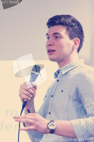 Image of businessman giving presentations at conference room