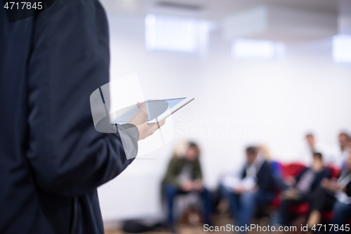 Image of businessman giving presentations at conference room