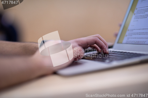 Image of business people hands using laptop computer