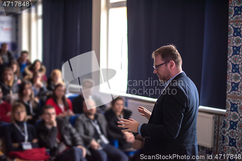 Image of businessman giving presentations at conference room