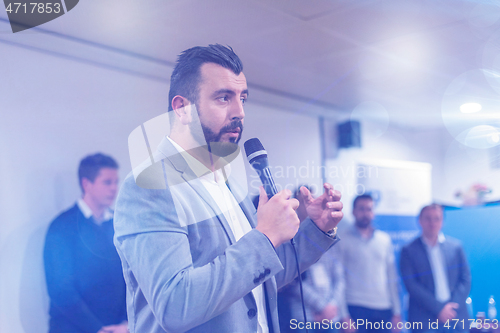 Image of businessman giving presentations at conference room