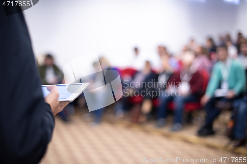 Image of businessman giving presentations at conference room