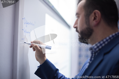 Image of businessman giving presentations at conference room