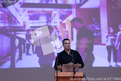 Image of businessman giving presentations at conference room