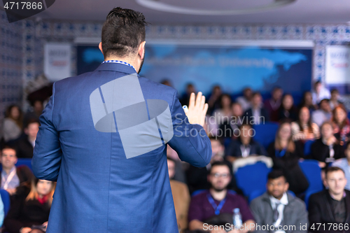 Image of businessman giving presentations at conference room