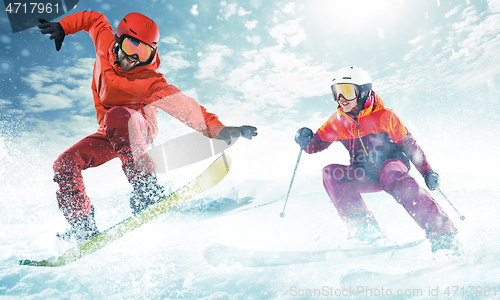 Image of Young people and winter sport, skiing against white alps mountains
