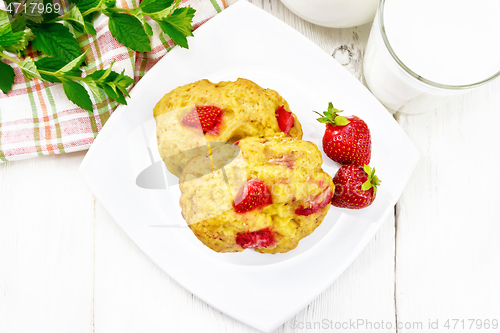 Image of Scones with strawberry in plate on board top