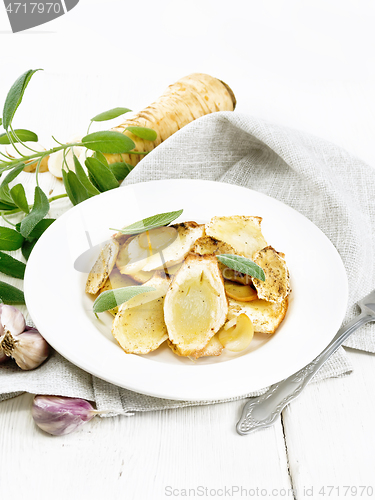 Image of Parsnips baked in plate on white board