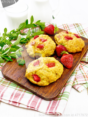 Image of Scones with strawberry on white board