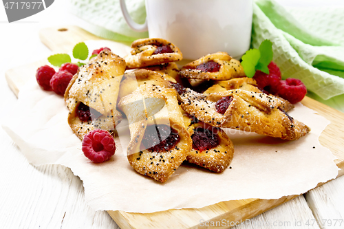 Image of Cookies with raspberries on white board