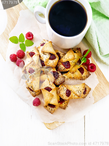 Image of Cookies with raspberries on board top