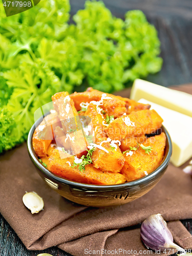 Image of Pumpkin fried with spices in bowl on napkin