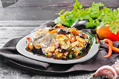 Image of Ragout with eggplant and pepper on black board