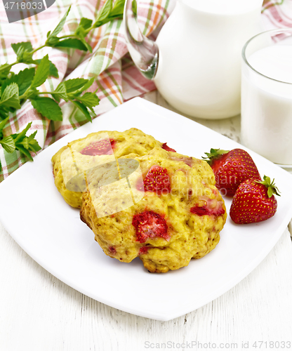 Image of Scones with strawberry in plate on board