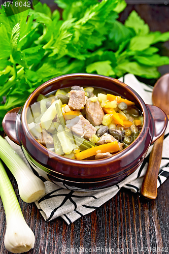 Image of Soup Eintopf in clay bowl on table