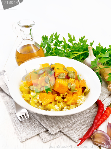 Image of Porridge millet with spicy pumpkin in plate on napkin