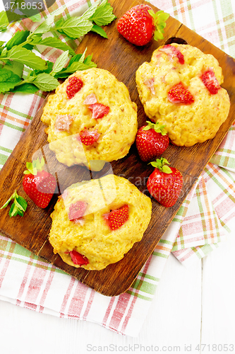 Image of Scones with strawberry on board top